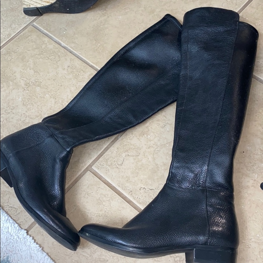 Black Michael Kors riding boots